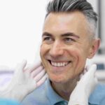 patient protecting oral health with dental crowns